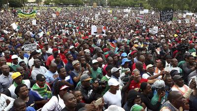 Thousands of protesters gather on the lawns of the government’s Union Buildings in Pretoria in one of several demonstrations held in South African cities on April 7, 2017 over president Jacob Zuma’s dismissal of the respected finance minister Pravin Gordhan. Phil Magakoe / AP Photo