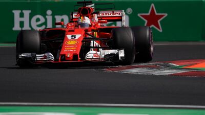 Ferrari driver Sebastian Vettel, of Germany, steers his car during qualifiers for the Formula One Mexico Grand Prix auto race at the Hermanos Rodriguez racetrack in Mexico City. AP Photo/Rebecca Blackwell