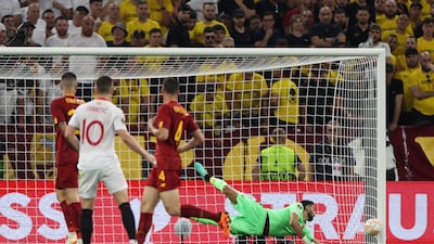 Sevilla's Ivan Rakitic hits the post as Roma's Rui Patricio dives. Reuters