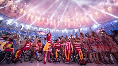Participants react under fireworks during the opening ceremony of the Rio 2016 Paralympic Games at the Maracana stadium in Rio de Janeiro on September 7, 2016. Yasuyoshi Chiba / AFP