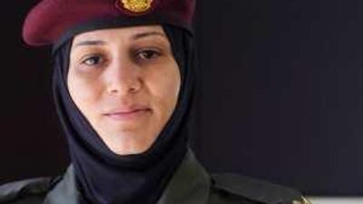 Warrant Officer Salma al Kaabi shows her pride at yesterday's ceremony.