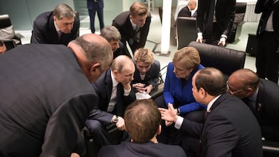 Egyptian President Abdul Fattah al-Sisi (R), Russian President Vladimir Putin (2ndL), German Chancellor Angela Merkel (2ndR) and French President Emmanuel Macron (front) talk on the sidelides of a Peace summit on Libya in Berlin. AFP