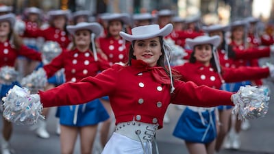 Performers move through Sixth Avenue. AP Photo