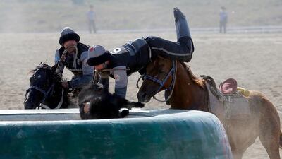 Kazakh and US horsemen take part in kok-boru. EPA