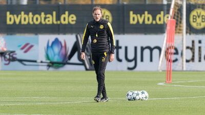 Borussia Dortmund manager Thomas Tuchel observes training. Guido Kirchner / DPA / AFP