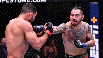 Anthony Hernandez, right, punches Rodolfo Vieira of Brazil in their middleweight fight during the UFC 258 event at UFC APEX in Las Vegas, Nevada. Jeff Bottari / Zuffa LLC / UFC