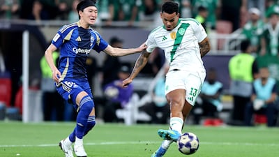 Galeno of Al Ahli takes a shot while under pressure from Hotaka Nakamura of Machida Zelvia. Getty Images