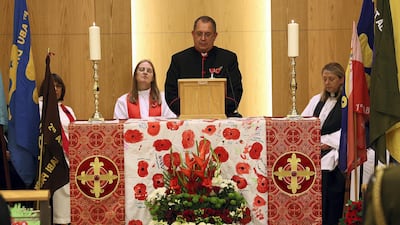 Reverend Andy Thompson addresses a large crowd paying tribute to those who gave up their lives in service of their countries in conflicts across the world