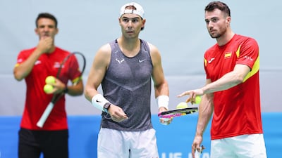 Rafael Nadal, centre, talks to Pedro Martinez during a practice session in Malaga ahead of Spain's Davis Cup match against the Netherlands. Getty Images