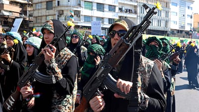 Members of Iran's Basij paramilitary force march in Tehran. The war is of a particular concern to economists. AFP