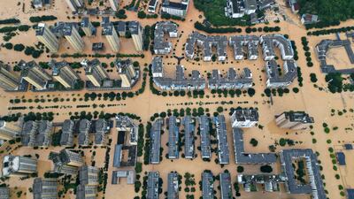Buildings and roads half submerged in floodwaters after heavy rain in Rongjiang county, Guizhou province, China. Reuters