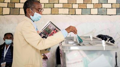 Ayalew Wedajo, 60, casts his ballot inside a polling station in Addis Ababa, Ethiopia. Reuters