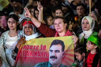 Supporters attend a rally airing a televised statement by jailed PKK leader Abdullah Ocalan, in the mainly Kurdish Syrian city of Qamishli, on July 9. AFP