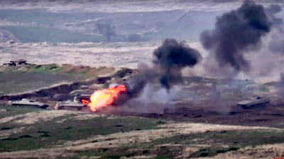 In this image taken from a footage released by Armenian Defense Ministry, Armenian forces destroy Azerbaijani military vehicle at the contact line of the self-proclaimed Republic of Nagorno-Karabakh, Azerbaijan. AP