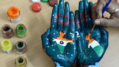An Indian student gets her palms painted ahead of Indian Independence Day celebrations in Chennai. Arun Sankar/AFP