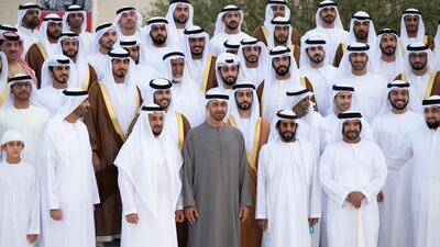 From right to left, Sheikh Ahmed bin Mohamed bin Rashed; Sheikh Saif bin Mohamed; Sheikh Tahnoun bin Mohamed, Ruler's Representative in Al Ain Region; Sheikh Mohamed bin Zayed, Crown Prince of Abu Dhabi and Deputy Supreme Commander of the Armed Forces; Sheikh Hamdan bin Zayed, Ruler’s Representative in Al Dhafra Region; Sheikh Saeed bin Zayed, Abu Dhabi Ruler's Representative; and Sheikh Hamdan bin Mansour bin Zayed stand for a photograph during a group wedding reception for Sheikh Zayed bin Mansour bin Zayed (2nd row, 4th R) and Sheikh Hazza bin Hamdan bin Zayed (2nd row, 5th R).