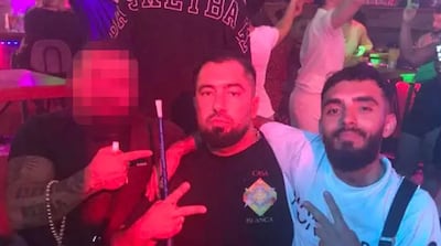 Rawa Majid, centre, with one of his criminal associates. Photo: Police handout