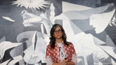 Francesca Albanese with Picasso's Guernica, a painting she has compared to the Israeli destruction of Gaza. EPA