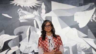 Francesca Albanese with Picasso's Guernica, a painting she has compared to the Israeli destruction of Gaza. EPA