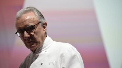 Newly named three-star chef for his restaurant at Plaza Athenee in Paris, French chef Alain Ducasse stands on stage during the launch of the 2016 France’s Michelin Guide, on February 1, 2016 in Paris. AFP
