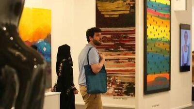 Omar Kholeif, above, at Art Dubai 2013, is the editor at Ibraaz online arts magazine and the founder of the UK's Arab Film Festival. Kholeif believes that "curating and critiquing are the same practice". Pawan Singh / The National