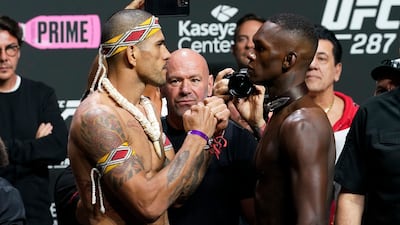 UFC middleweight champion Alex Pereira, left, faces challenger Israel Adesanya after the weigh-in for UFC 287. AP