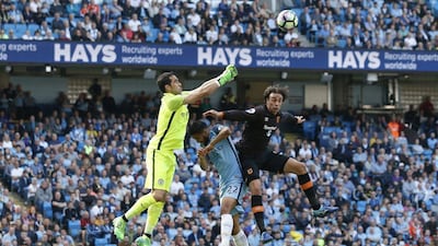 Hull City's Lazar Markovic, right, in action with Manchester City's Claudio Bravo, left, and Gael Clichy. Ed Sykes / Reuters