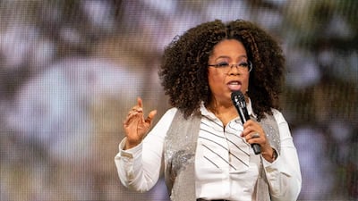 Oprah Winfrey wears a denim skirt with a white shirt and waistcoat to speak on stage during Oprah's 2020 Vision: Your Life in Focus Tour in Dallas, Texas on February 15, 2020. AFP