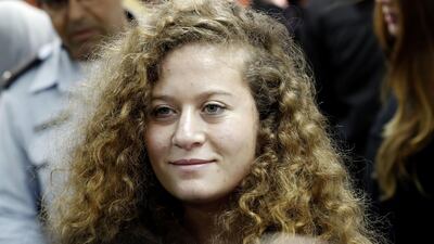 Seventeen-year-old Palestinian Ahed Tamimi, a well-known campaigner against Israel's occupation, arrives for the beginning of her trial in the Israeli military court at Ofer military prison in the West Bank village of Betunia on February 13, 2018. AFP