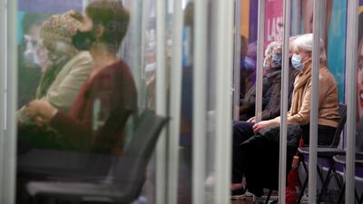 People wait to receive the Oxford/AstraZeneca COVID-19 vaccine at a Superdrug pharmacy in Guildford. Reuters