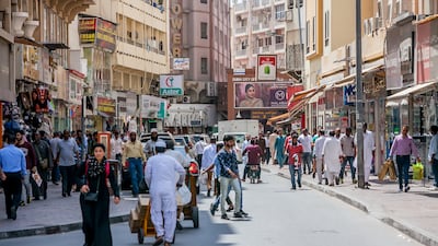 Pedestrians around Dubai Creek. Tenants and landlords can be held responsible for extensions added to residences without authorisation from Dubai Municipality.
