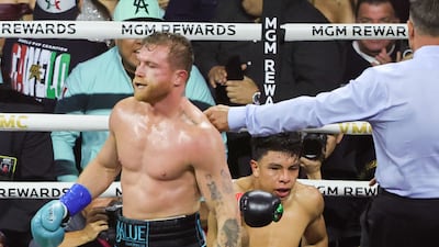 Canelo Alvarez walks away after knocking down Jaime Munguia in the fourth round. AFP