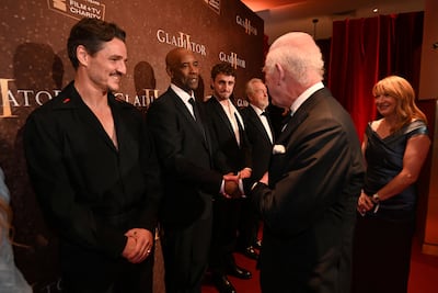 From left, Gladiator II stars Pedro Pascal, Denzel Washington and Paul Mescal with the UK's King Charles at the London premiere. Reuters