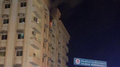 A family trapped were rescued from their burning apartment building by firefighters on Friday night in the eastern region of Sharjah. Photo courtesy of Sharjah Civil Defense
