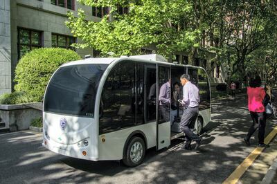 Passengers getting on a self-driving minibus at Shanghai Jiao Tong University in Shanghai.AFP
