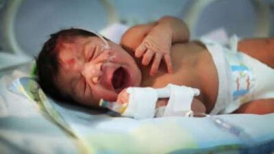 Zainab al Sinani's baby boy was born after the expectant mother was given a police escort to the Corniche Hospital.