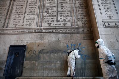 Cleanup operations to remove graffiti scrawled at the Arc de Triomphe continue. Reuters
