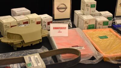 Counterfeit and genuine goods are displayed side by side during a seminar run by the Legal Group. Photo Courtesy The Legal Group