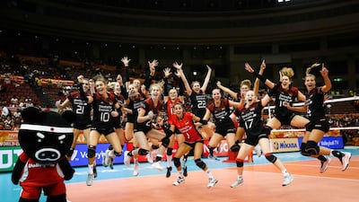 Germany's players jump up for a picture during their second round match against Brazil at the FIVB Volleyball Women's World Championship in Nagoya, northern Japan. AP Photo
