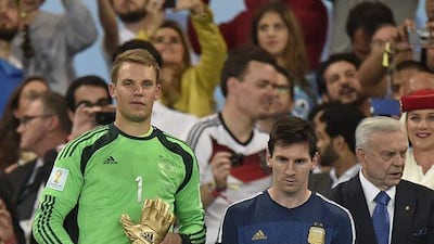 Germany's goalkeeper Manuel Neuer, left, winner of the golden glove award for best goalkeeper stands alongside golden ball winner Argentina's Lionel Messi after the World Cup final soccer match between Germany and Argentina at the Maracana Stadium in Rio de Janeiro, Brazil on Sunday, July 13, 2014. Germany won the match 1-0. AP Photo/Martin Meissner