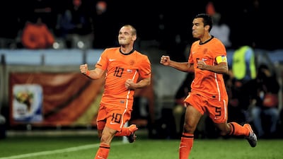 Wesley Sneijder of the Netherlands celebrates scoring his side's second goal with team mate Giovanni Van Bronckhorst, right, in their 3-2 win over Uruguay in the semi-finals in 2010. Sneijder was crucial to the Dutch run to the last final. Laurence Griffiths / Getty Images