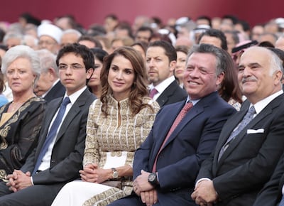 King Abdullah II and Queen Rania attend a ceremony on the occasion of Independence Day in Amman in 2012. AFP