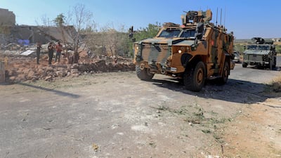 Turkish troops in armoured personnel carriers in the village of Iblin in the Jabal Al Zawiya region of Syria's rebel-held north-western Idlib province, on July 22, 2021. AFP
