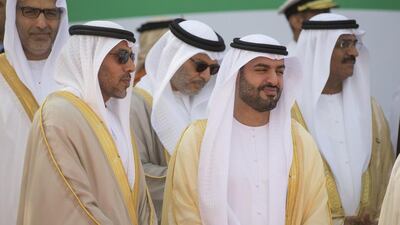 Major General Pilot Sheikh Ahmed bin Tahnoon, Chairman of the National and Reserve Service Authority, and Sheikh Mohammed bin Hamad bin Tahnoon, attend a flag raising ceremony in celebration of the UAE’s 43rd National Day at the Breakwater in Abu Dhabi. Donald Weber / Crown Prince Court - Abu Dhabi)