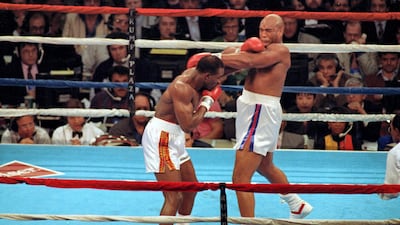 19 Apr 1991: Evander Holyfield lands a left punch during a fight against George Foreman in Atlantic City, New Jersey. Mandatory Credit: Rick Stewart /Allsport