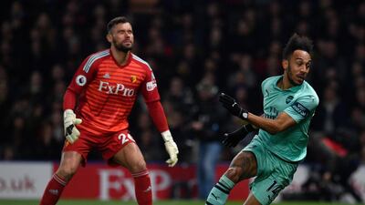 Watford's Ben Foster, left, watches as Arsenal's Pierre-Emerick Aubameyang scores what proved to be the winner at Vicarage Road. EPA