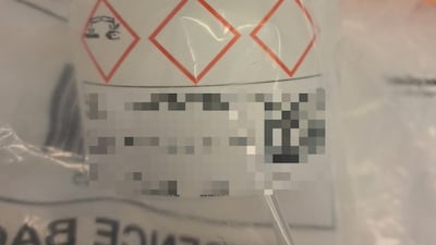 An empty container with corrosive warnings on the label was recovered at an address in Newcastle. PA