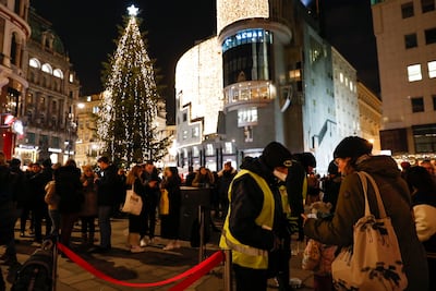 Security guards check vaccination passes at the entrance to a Christmas market in Vienna, Austria. AP