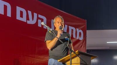 Eran Etzion speaks to a crowd during a protest march against the government in Haifa. Alamy