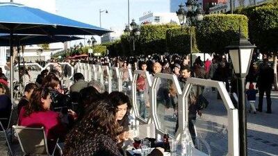 Tunisian women sit at a cafe's terrace in Tunis. REUTERS/Anis Mili